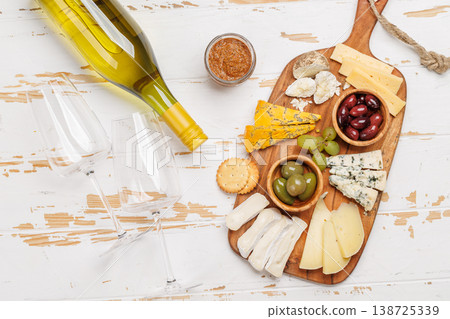 Cheese board with assorted cheeses and olives 138725339