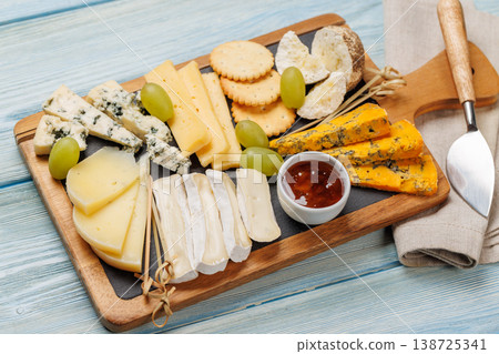 Cheese board with olives grapes and honey Cheese board with olives grapes and honey 138725341