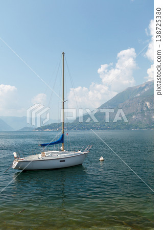 Boat on Lake Como near scenic shore Italy Boat on Lake Como near scenic shore Italy 138725380