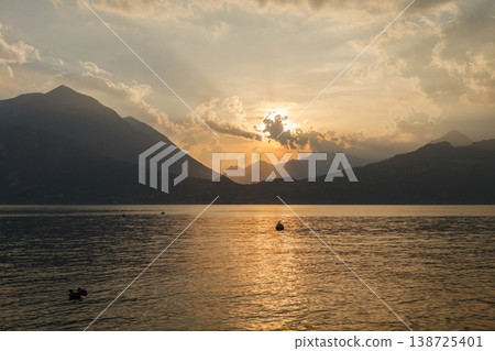 Sunset over Lake Como with mountains silhouette Sunset over Lake Como with mountains silhouette 138725401