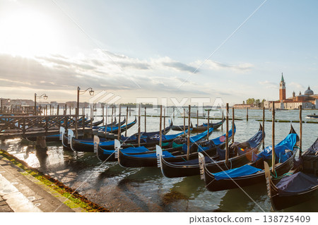 Gondolas moored on Venice lagoon 138725409