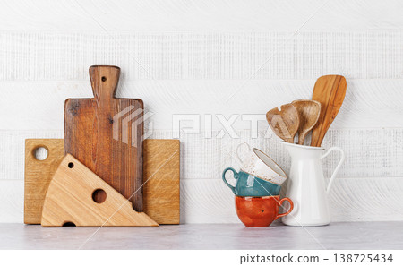 Kitchen utensils and cutting boards on table Kitchen utensils and cutting boards on table 138725434