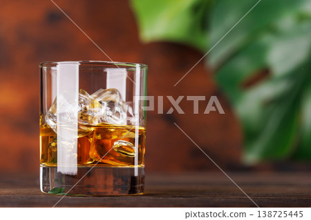 Glass of whiskey with ice 138725445