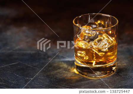 Glass of whiskey with ice 138725447