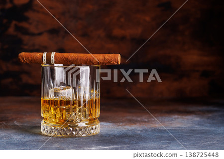Glass of whiskey with ice and cigar 138725448
