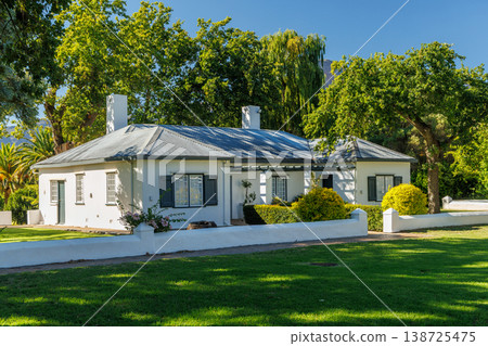Winery mansion surrounded by greenery in South Africa 138725475
