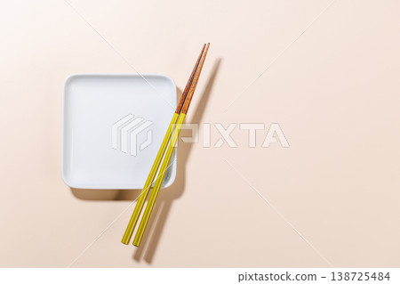 Minimal Sushi Plate with Chopsticks on Beige Background 138725484
