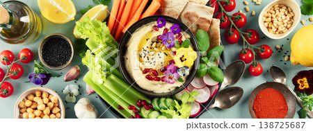 Colorful Hummus Platter with Fresh Vegetables and Pita 138725687