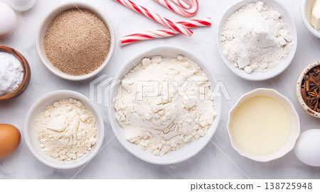 Ingredients for making dough are set on a kitchen table, including flour, butter, and sugar, preparing for baking cookies ahead of the holiday season Ingredients for making dough are set on a kitchen table, including flour, butter, and sugar, preparing for baking cookies ahead of the holiday season 138725948