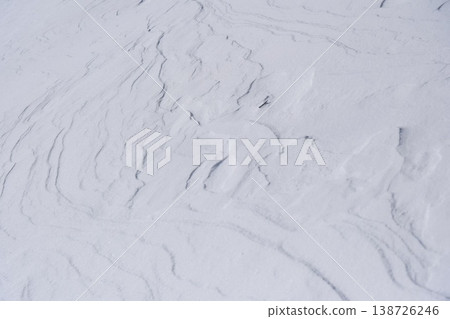 A full-surface wind pattern and snow surface texture that is easy to add text to, a winter snow mountain background material. A full-surface wind pattern and snow surface texture that is easy to add text to, a winter snow mountain background material. 138726246