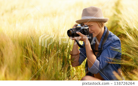 Woman, camera and photography in grass with travel, vacation and holiday with wheat field and plants. Nature, photographer and outdoor with blog and countryside with photo for adventure and journey Woman, camera and photography in grass with travel, vacation and holiday with wheat field and plants. Nature, photographer and outdoor with blog and countryside with photo for adventure and journey 138726264