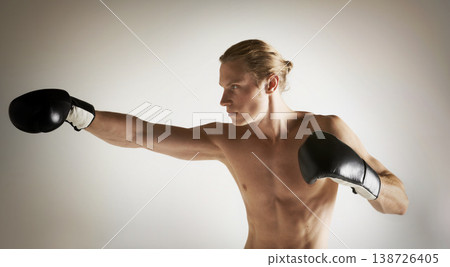 Fighting, boxing and shirtless with man, training and exercise with health on a studio white background. Person, guy and professional with competition, practice for a match and muscle with workout Fighting, boxing and shirtless with man, training and exercise with health on a studio white background. Person, guy and professional with competition, practice for a match and muscle with workout 138726405