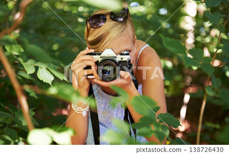 Camera lens, shooting and photographer with woman in forest for relax, memory and travel photography. Summer, trees and adventure with person in nature for vacation, holiday and environmental tourism Camera lens, shooting and photographer with woman in forest for relax, memory and travel photography. Summer, trees and adventure with person in nature for vacation, holiday and environmental tourism 138726430