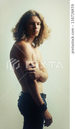 Man, serious and shirtless in studio for fitness, wellness and body on white background. Model, person and topless for health, selfcare or healthy with fashion jeans, confidence and exercise Man, serious and shirtless in studio for fitness, wellness and body on white background. Model, person and topless for health, selfcare or healthy with fashion jeans, confidence and exercise 138726659