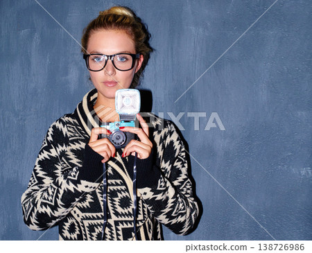 Woman, portrait and retro camera on wall background for aesthetic, shooting or creative image. Photography, person or girl and face with vintage, picture and serious for memory on mock up space 138726986