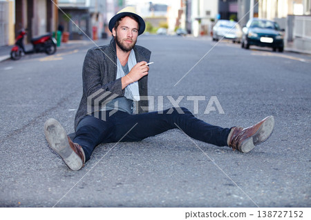 Portrait, outdoor and man smoking, fashion on the ground and relax with trendy clothes, New York and stylish. Person, outdoor and guy with cigarette, tobacco and smoke with casual, outfit and city Portrait, outdoor and man smoking, fashion on the ground and relax with trendy clothes, New York and stylish. Person, outdoor and guy with cigarette, tobacco and smoke with casual, outfit and city 138727152