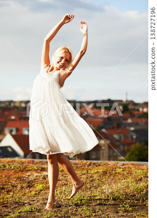 Woman, joyful and dancer on vacation, summer and outdoor for holiday, smiling and dress. Rooftop, dancing and urban area for break, getaway and carefree on skyline, barefoot and amsterdam spring time Woman, joyful and dancer on vacation, summer and outdoor for holiday, smiling and dress. Rooftop, dancing and urban area for break, getaway and carefree on skyline, barefoot and amsterdam spring time 138727196