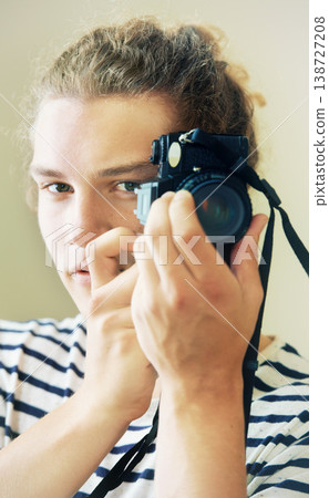 Photography, portrait or man with camera isolated on white background for creative artist job or talent. Art, studio or face of gen z photographer with hobby or career taking picture for photoshoot 138727208