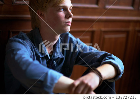 Thinking, depression and an unhappy boy student at school as an outcast feeling lonely in a classroom. Education, scholarship and a sad young child in a class looking bored while alone on campus Thinking, depression and an unhappy boy student at school as an outcast feeling lonely in a classroom. Education, scholarship and a sad young child in a class looking bored while alone on campus 138727215