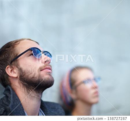 Thinking, man and city with sunglasses for relax, peace and idea outdoor against wall with eyewear. Couple, people and thoughtful with memory, remember and leaning with shades and casual smile Thinking, man and city with sunglasses for relax, peace and idea outdoor against wall with eyewear. Couple, people and thoughtful with memory, remember and leaning with shades and casual smile 138727287