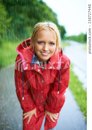 Smile, portrait and young woman in the rain with coat in nature, road or street for winter. Happy, positive attitude and female person from Australia in drizzle or storm weather in outdoor forest. Smile, portrait and young woman in the rain with coat in nature, road or street for winter. Happy, positive attitude and female person from Australia in drizzle or storm weather in outdoor forest. 138727448