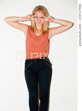 Fashion, peace sign and portrait of woman with attitude on white background with pride, beauty and emoji. Cosmetics, hand gesture and isolated person in trendy clothes, outfit and style in studio Fashion, peace sign and portrait of woman with attitude on white background with pride, beauty and emoji. Cosmetics, hand gesture and isolated person in trendy clothes, outfit and style in studio 138727492