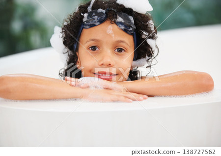 Portrait, children and bath with a boy in goggles while cleaning his skin in the home for natural hygiene. Face, kids and a happy young child in the bathroom to wash with soap or foam in water Portrait, children and bath with a boy in goggles while cleaning his skin in the home for natural hygiene. Face, kids and a happy young child in the bathroom to wash with soap or foam in water 138727562