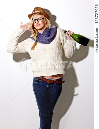Champagne, drunk or portrait of woman in studio for a fun celebration, party or adult event. Face, hand gun or wild person drinking alcohol or beverage in bottle for New Year on white background 138727658