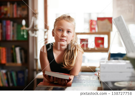 Girl kid in portrait, book and education, story for knowledge or entertainment with customer in bookshop. Library, store and learn for development and growth, fiction or literature with young child Girl kid in portrait, book and education, story for knowledge or entertainment with customer in bookshop. Library, store and learn for development and growth, fiction or literature with young child 138727758