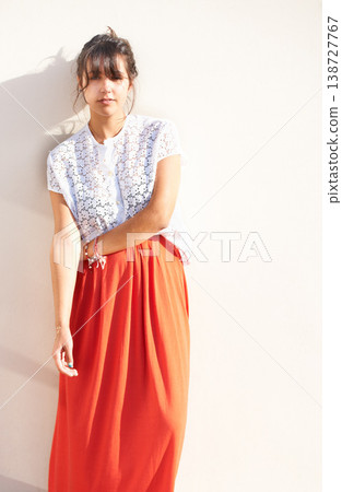 Smile, stylish and portrait of a woman on a city wall for fashion, break or enjoying summer. Happy, cool and a young girl or person in town with fashionable clothes for streetwear or outdoor style Smile, stylish and portrait of a woman on a city wall for fashion, break or enjoying summer. Happy, cool and a young girl or person in town with fashionable clothes for streetwear or outdoor style 138727767