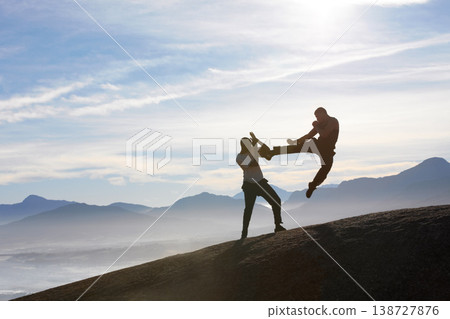 Mountain top, karate men and jump, kick or fitness training in nature for body, speed or power on sky background. Martial arts, taekwondo or MMA friends workout outdoor for cardio, exercise or sports 138727876