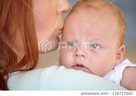 Kiss, baby and portrait of newborn with mother in home bonding together with affection. Calm, face and mom carrying infant child in arms to relax in house with love, care and support with mommy Kiss, baby and portrait of newborn with mother in home bonding together with affection. Calm, face and mom carrying infant child in arms to relax in house with love, care and support with mommy 138727882