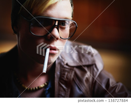 Portrait, addiction and a boy smoking a cigarette closeup for nicotine or tobacco dependency in sunglasses. Face, smoke and bad habit with a young person inhaling an addictive substance for cancer 138727884