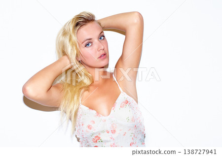 Fashion, portrait and woman in a dress in a studio for trendy, stylish and elegant style. Confidence, serious and young beautiful female person from Australia in cute outfit by white background. Fashion, portrait and woman in a dress in a studio for trendy, stylish and elegant style. Confidence, serious and young beautiful female person from Australia in cute outfit by white background. 138727941