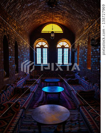 A traditional Middle Eastern-style interior space bathed in lantern light A traditional Middle Eastern-style interior space bathed in lantern light 138727969