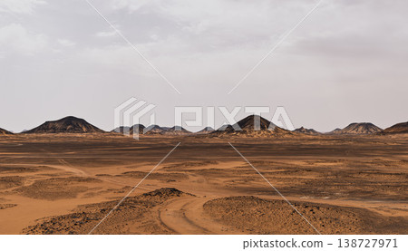 A panoramic view of volcanic cones in the Egyptian Black Desert. A panoramic view of volcanic cones in the Egyptian Black Desert. 138727971