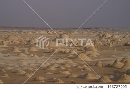 A desolate desert landscape with countless limestone hills. A desolate desert landscape with countless limestone hills. 138727995
