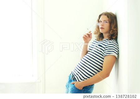 Smoking, cigarette and portrait of man in home, apartment or relax in living room. Person, smoke and breathing with tobacco in house for calm feeling, cool aesthetic or model with a nicotine habit Smoking, cigarette and portrait of man in home, apartment or relax in living room. Person, smoke and breathing with tobacco in house for calm feeling, cool aesthetic or model with a nicotine habit 138728102