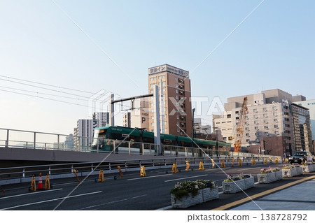 A Hiroshima Electric Railway streetcar running near Hiroshima Station. A Hiroshima Electric Railway streetcar running near Hiroshima Station. 138728792