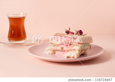 Minimal pastel dessert with tea glass elegant food styling concept 138728847