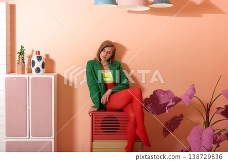 Serene woman in relaxed pose with retro musical equipment Serene woman in relaxed pose with retro musical equipment 138729836