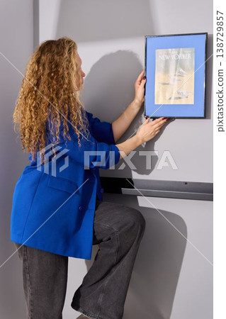 Caucasian woman lifestyle influencer revealing artwork Caucasian woman lifestyle influencer revealing artwork 138729857