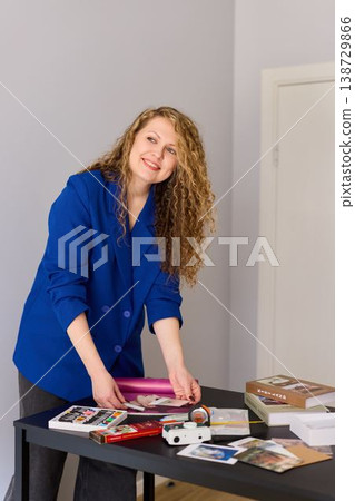 Woman working on handcrafted paper goods in home studio environment 138729866