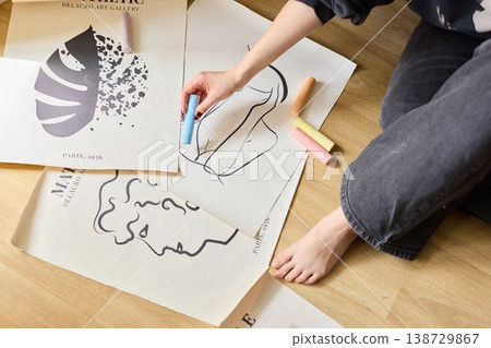 Caucasian artist staging monochrome prints for portfolio Caucasian artist staging monochrome prints for portfolio 138729867