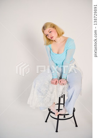 quiet portrait white woman sitting on stool thoughtful quiet portrait white woman sitting on stool thoughtful 138729891