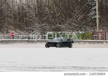 Emergency braking near barrier during winter driving training session 138729904