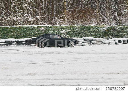 Resting vehicle surrounded by icy snow and crew preparations Resting vehicle surrounded by icy snow and crew preparations 138729907