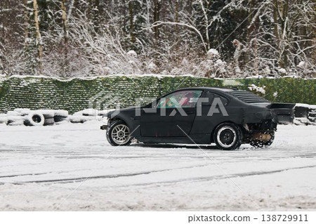 Highenergy scene of car in action with snow and sparks flying Highenergy scene of car in action with snow and sparks flying 138729911