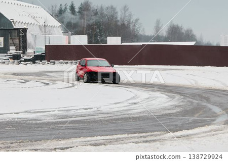 Practicing automobile maneuvering amidst snow and slippery surfaces Practicing automobile maneuvering amidst snow and slippery surfaces 138729924
