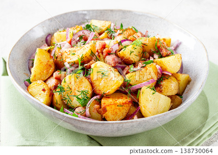 German potato salad, with bacon, onion and herbs, served in a bowl, homemade, no people, German potato salad, with bacon, onion and herbs, served in a bowl, homemade, no people, 138730064